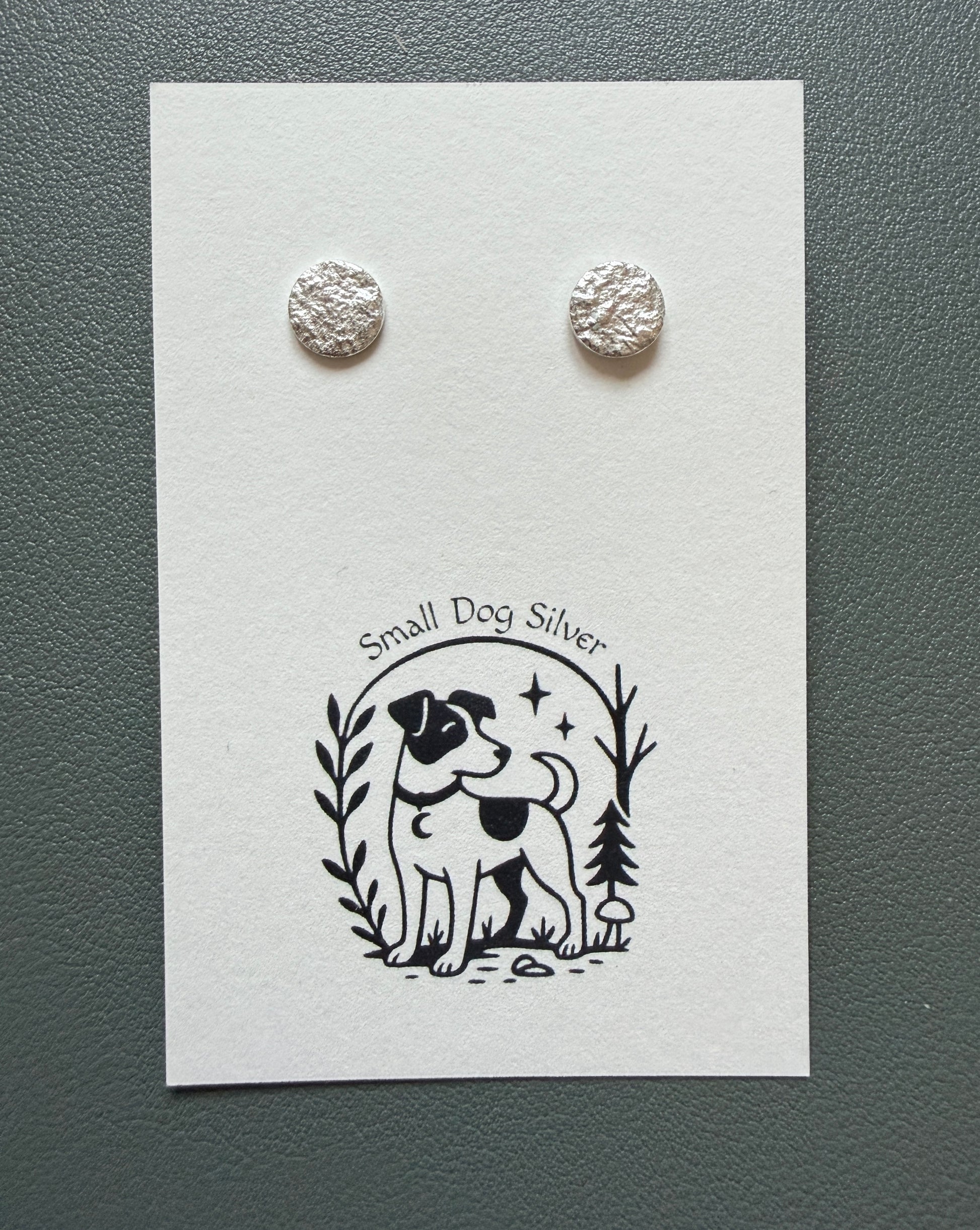 Silver round earrings on a card with 'Small Dog Silver' branding.