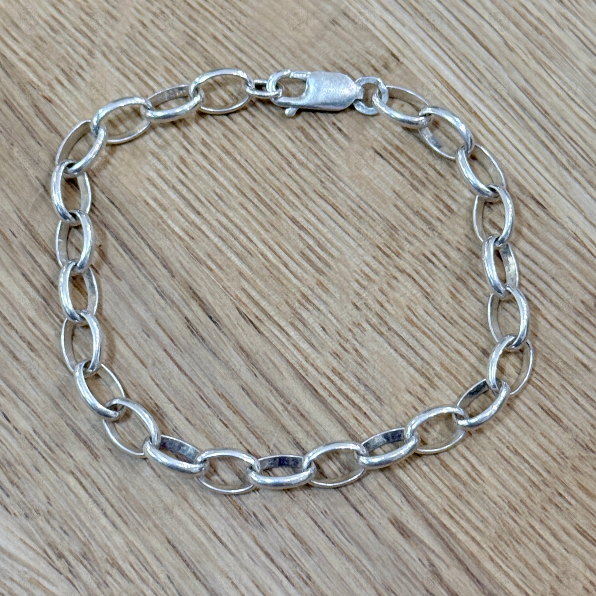 A chain bracelet on a wooden background