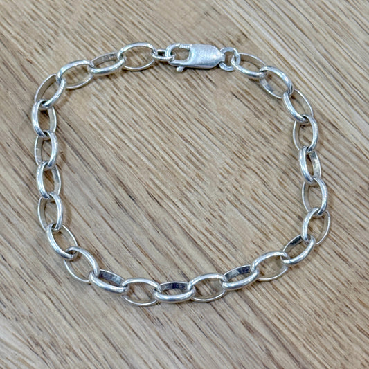 A chain bracelet on a wooden background