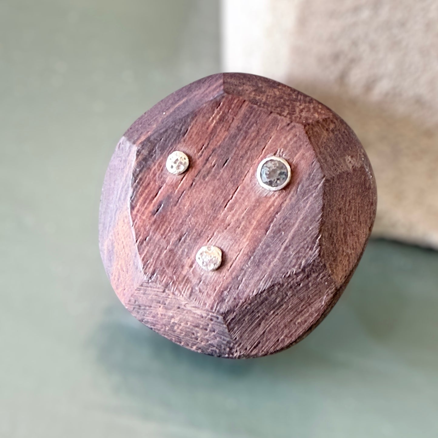 Wooden Brooch with sapphire and silver studs against a sage & white background