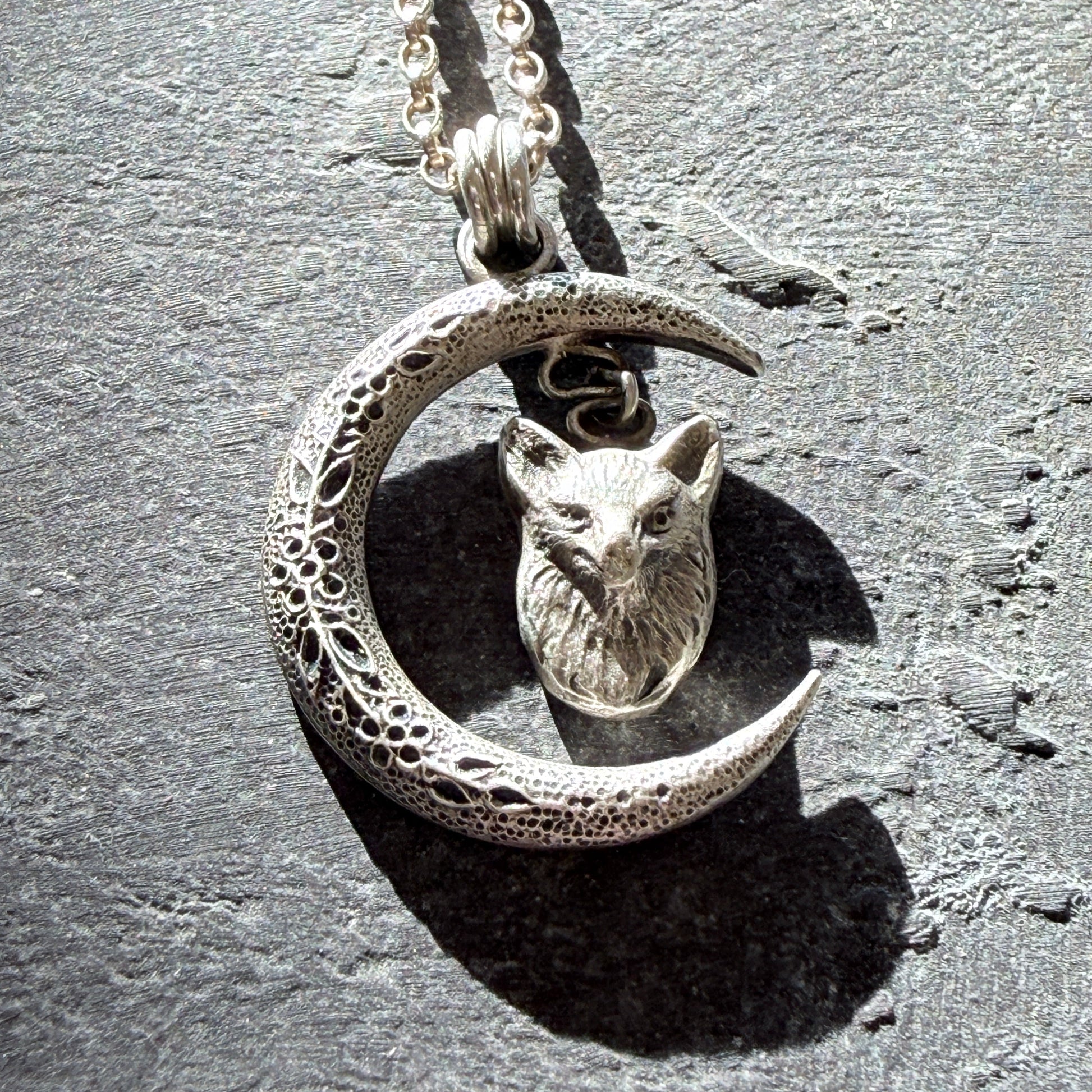 fox head pendant on a slate background