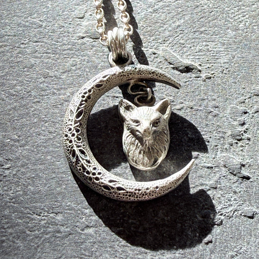 fox head pendant on a slate background