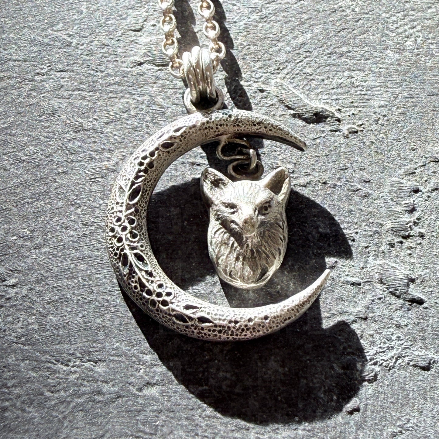 fox head pendant on a slate background